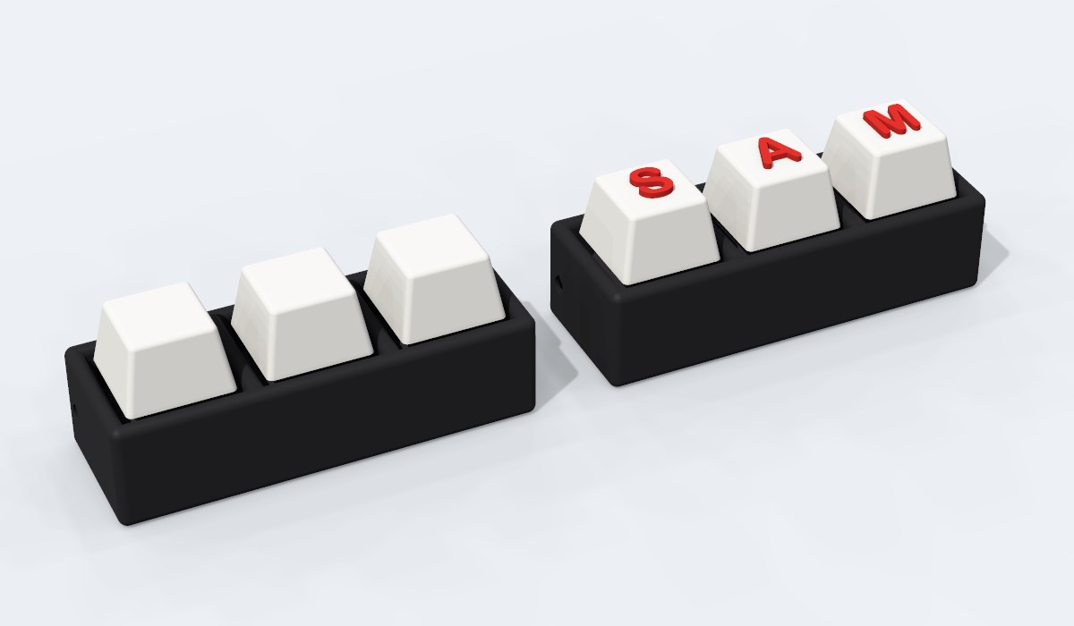 Two Triple clickers with black bodies: one with plain white caps, one spelling SAM in red letters